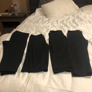 4 pairs of black leggings.